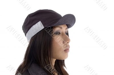 side pose of female wearing security cap