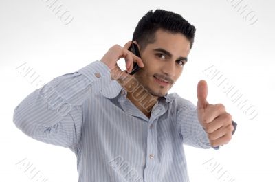 man talking on cell phone and wishing goodluck