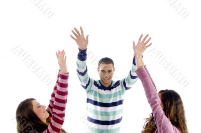 young friends with raised arms