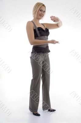 standing woman making hand gesture
