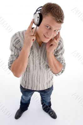 standing man with headphone