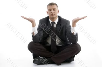 businessman doing yoga with open palms