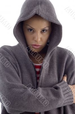 female with hood coat looking at camera