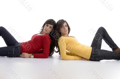 two friends lying and looking at camera