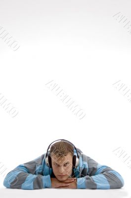 laying young man with headphone