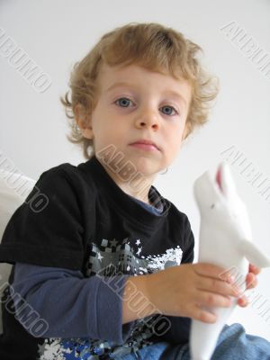 boy with a plastic whale