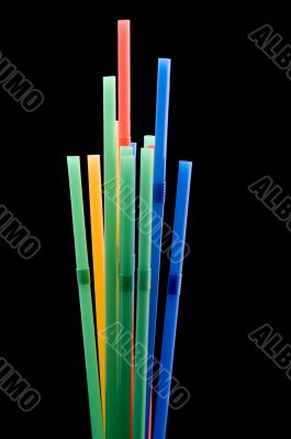 drinking straws on black closeup