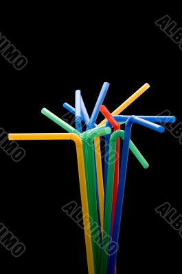 drinking straws on black macro