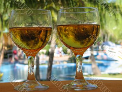 glasses of beer by the pool