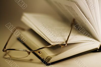 opened book and glasses