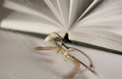 opened book and glasses