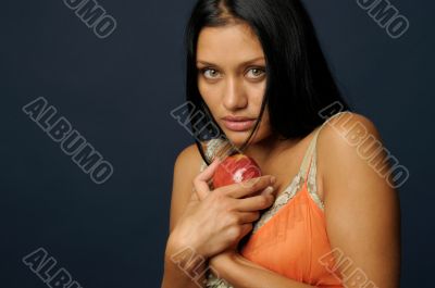 Beautiful exotic woman with apple