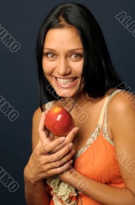 Beautiful exotic woman with apple