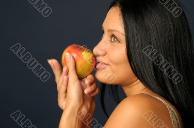 Beautiful exotic woman with apple