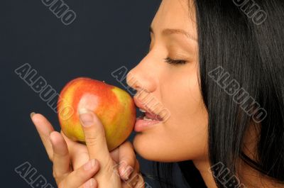 Beautiful exotic woman with apple