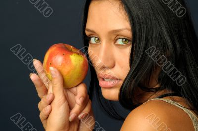 Beautiful exotic woman with apple