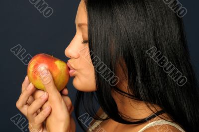 Beautiful exotic woman with apple