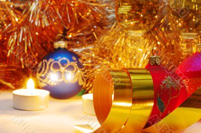 The burning candles, balls and ribbons it are Christmas