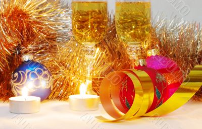 The burning candles, balls and ribbons it are Christmas