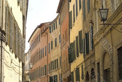 Old typical street in SIena (Tuscany)