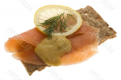 Salmon garnished on crispbread