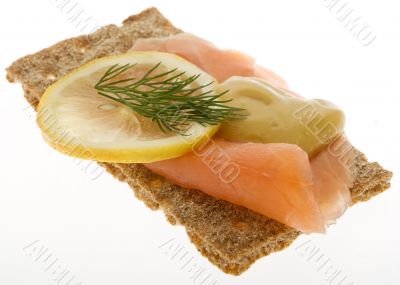Salmon garnished on crispbread