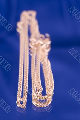 Golden chain on blue