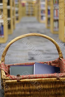 Basket of books in library