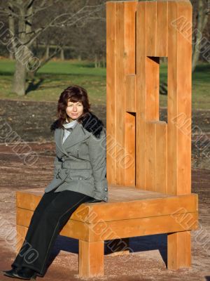 Woman sitting on the chair in the park
