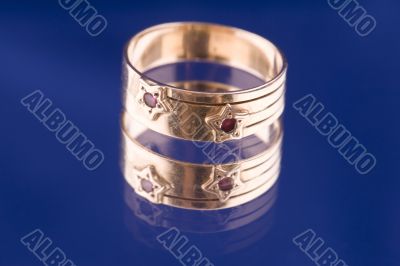 Golden ring macro on blue