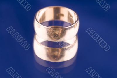 Golden ring closeup on blue