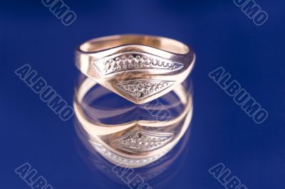 Golden ring macro on blue