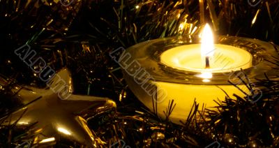 Golden star in candle light