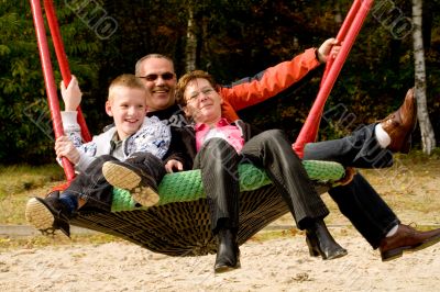 Happy family swinging