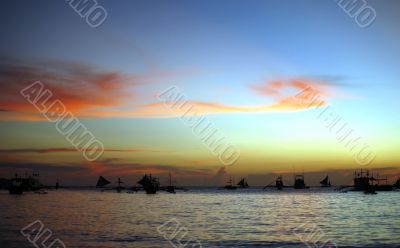 Drifting boat on a sunset