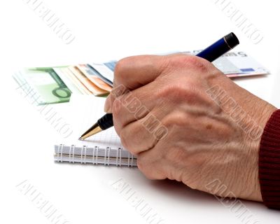 Hand, pen, notebook and money