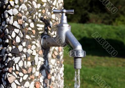 Running water tap in a garden