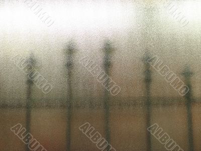 fence through a frosted glass