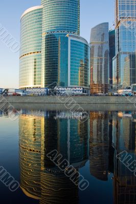 Skyscrapers at sunset and reflection