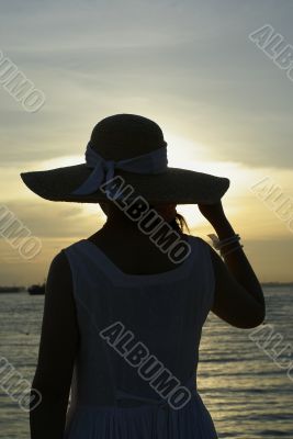 Beach female hat sunset silhouette