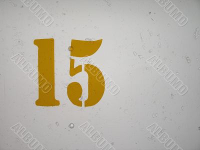 yellow number on a wall