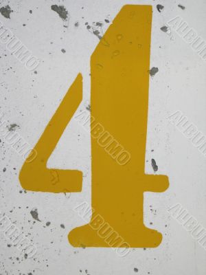 yellow number on a wall