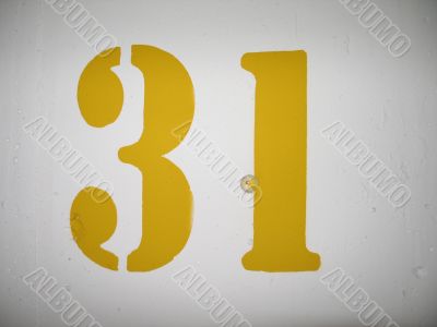 yellow number on a wall