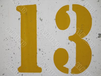 yellow number on a wall