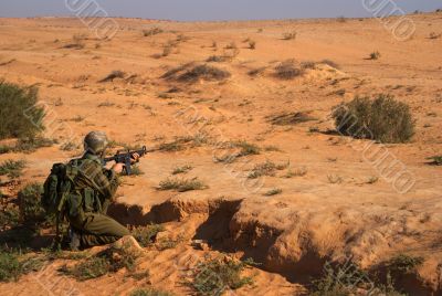 Israeli soldiers excersice in a desert