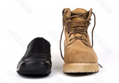 Men`s dress shoe beside workboot