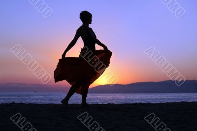 Woman walking on the beach