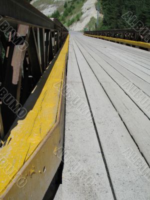wooden bridge with yellow line