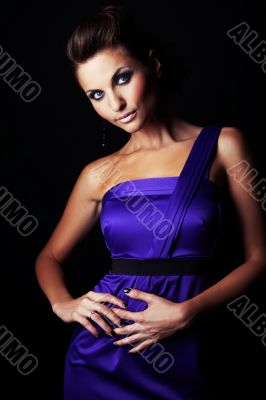 sexy brunette fashion girl in violet dress - portrait
