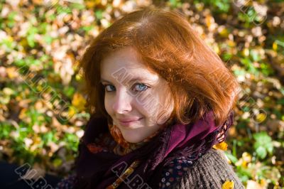 girl against autumn foliage